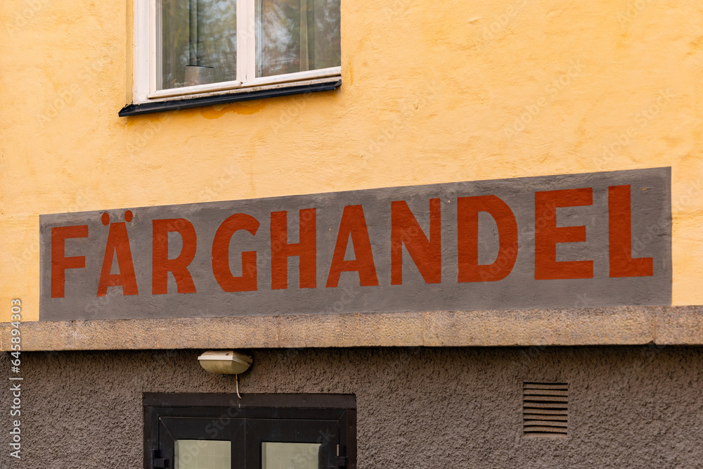 Stockholm, Sweden A sign on the facade of a building in Swedish says Farghandel, or Paint shop.
