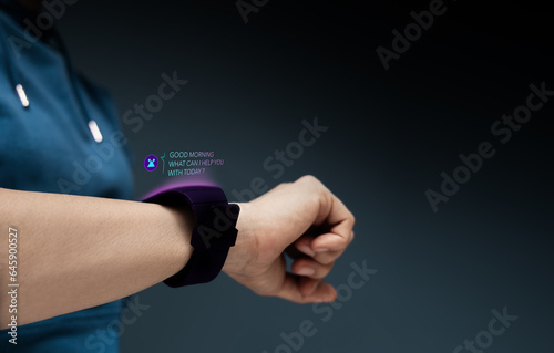 Chatbot, LiveChat Technology Concept. Woman Using Smart Watch To Make Conversation with an Artificial Intelligence Service. Virtual Assistant for Customer Support Information. photo