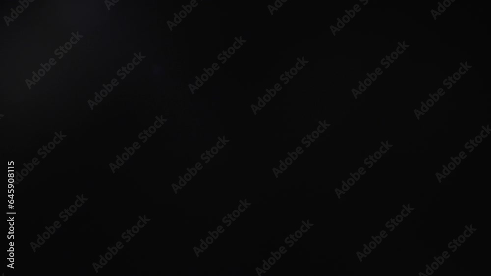 lens flare effects on black background.4k lens flare effects on black background.4k
