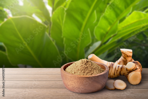 galangal powder on wooden table photo