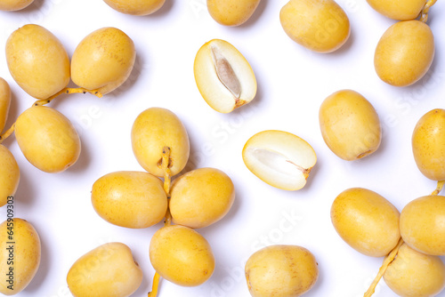 Yellow date fruit on white background