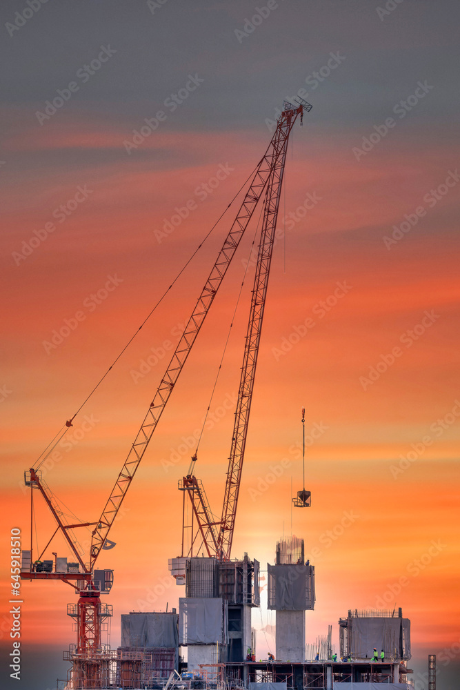 Tower crane and building construction site, Workers are working on construction sites and cranes are working in the industry new building business, Construction of new residential high-rise building.