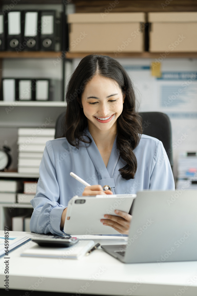 Learning online working concept. Businesswoman working on tablet and laptop computer, searching working in office. Learning online working concept. Businesswoman working on tablet and laptop computer, searching working in office.