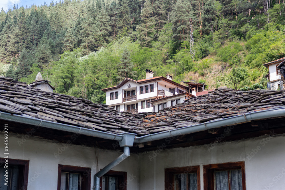 Shiroka Laka, Bulgaria hill side old houses view. Old Bulgarian houses. Cobblestone street Shiroka Laka, Bulgaria hill side old houses view. Old Bulgarian houses. Cobblestone street