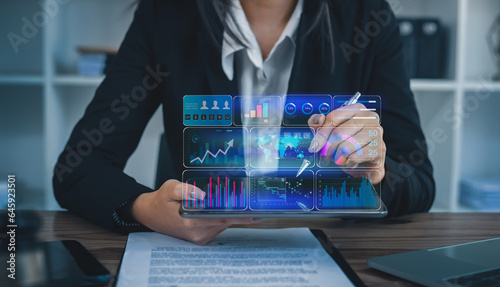 Technology and financial advisory services concept. Business hands working on digital laptop or tablet computer with business analysis and data management system for finance, Digital marketing.