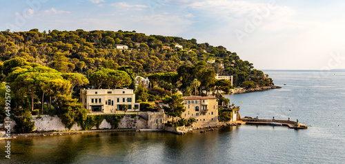 Panoramic view of Saint-Jean-Cap-Ferrat resort town on Cap Ferrat cape with exclusive estates at French Riviera of Mediterranean Sea in France