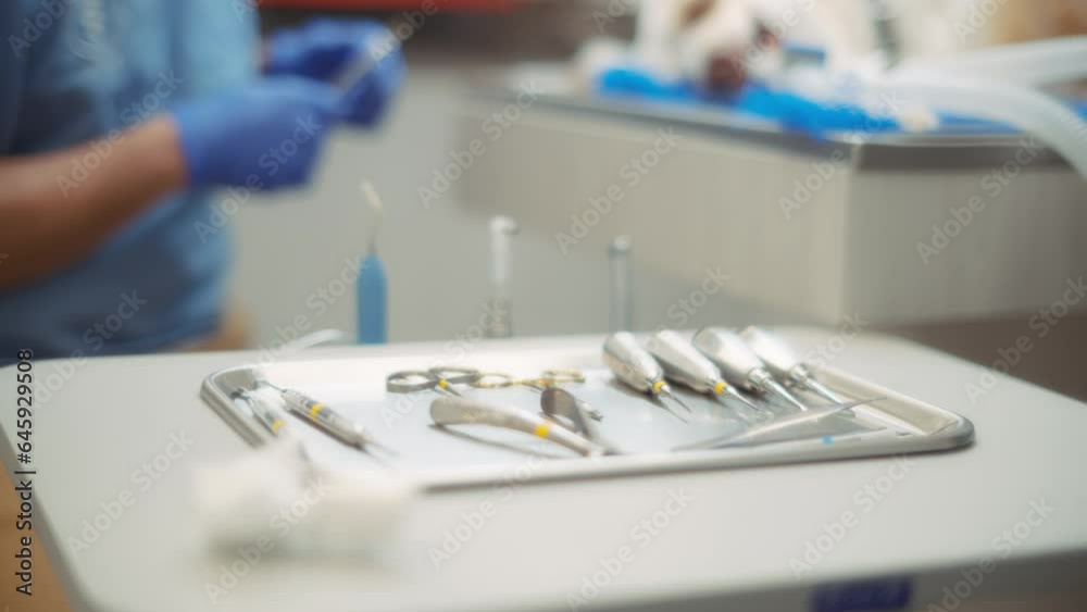 Close up of surgical tools on the tray at the vet clinic. Slow motion. 