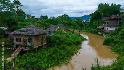 Village and mountain in Vang Vieng, Laos, Nam Song River in Vang Vieng, Laos.