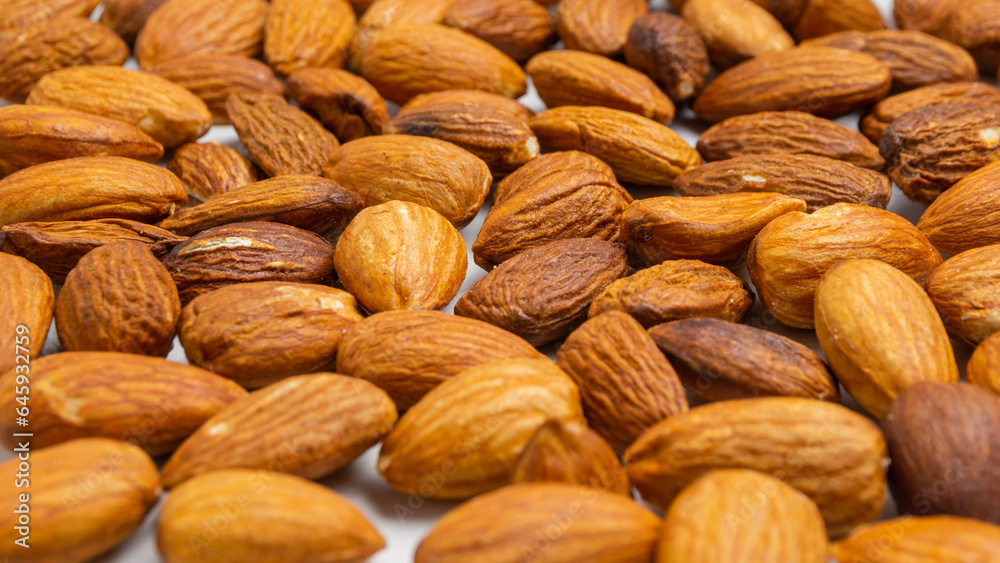 Almonds on white background. Raw peeled almond nuts texture Almonds on white background. Raw peeled almond nuts texture