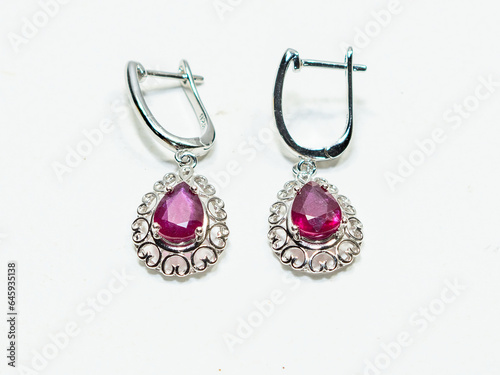 Ruby silver earrings display on white background