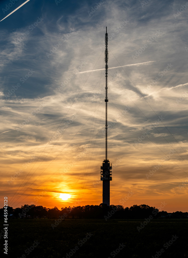 Radio tower against the background of a spectacular sunset