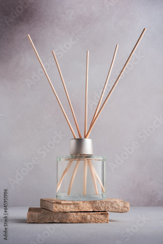 Home fragrance diffuser with reed sticks
