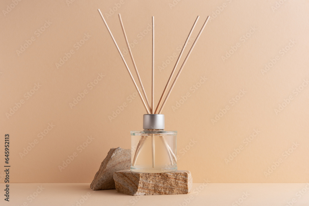 Home fragrance diffuser with reed sticks