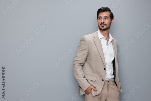 happy man business businessman handsome smiling sexy suit copyspace portrait beige