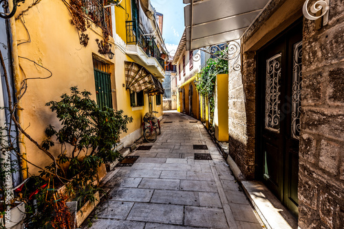 Fototapeta Naklejka Na Ścianę i Meble -  Colourful Lefkada street with yellow buildings, Lefkada, Greece