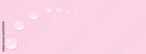 Drops of transparent gel or water in the shape of a semi-circle, with decreasing size. On a pink background. © Marina Red