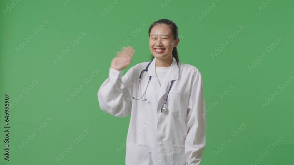 Asian Female Doctor With Stethoscope Waving Hand And Smiling While Walking On Green Screen Background In The Hospital
Asian Female Doctor With Stethoscope Waving Hand And Smiling While Walking On Green Screen Background In The Hospital