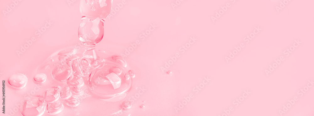 Dropping gel from an eyedropper on a pink background. Cosmetics Lab. Serum, gel, retinol, oil. Dropping gel from an eyedropper on a pink background. Cosmetics Lab. Serum, gel, retinol, oil.