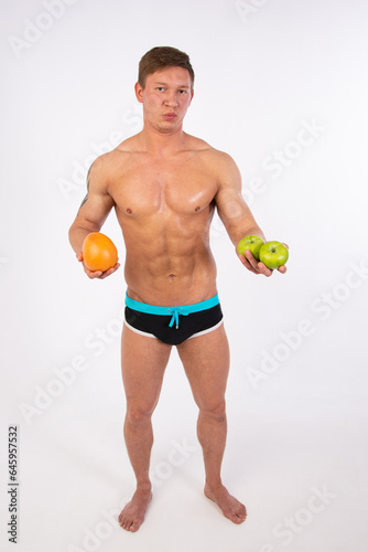 Diet  sport and healthy lifestyle. A guy with a beautiful body. Proper nutrition and sports supplements.