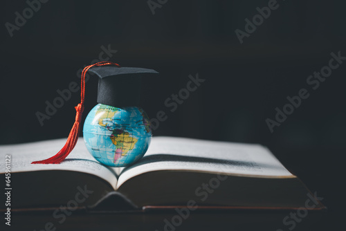 Graduated study abroad international Conceptual, Graduation hat on top Earth globe model map.Congratulations to graduates, Studies lead to success in world wide.Back to School. credited world by NASA photo