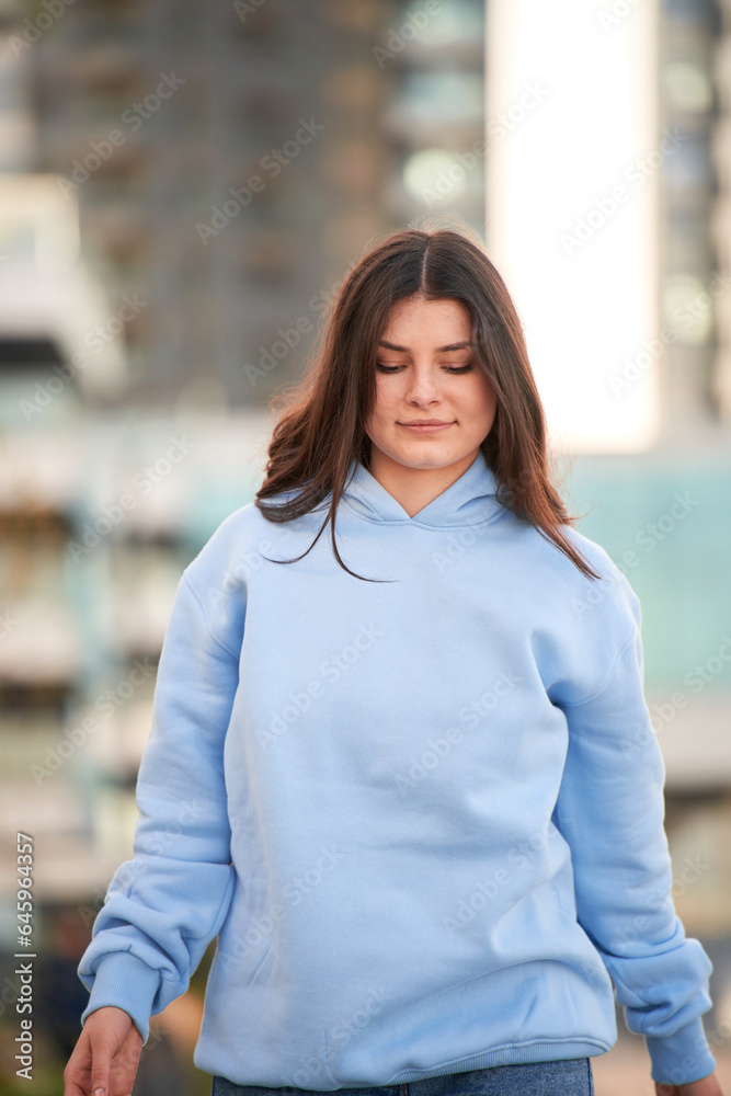 woman wears a plain hoodie. Clothes mockup for logo and branding woman wears a plain hoodie. Clothes mockup for logo and branding