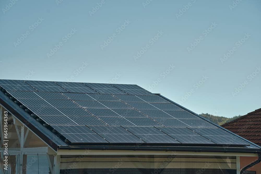 House roof with solar panels installed. The integration of solar technology into the roof tiles highlights the innovative approach to energy generation, offering an alternative source of electricity. House roof with solar panels installed. The integration of solar technology into the roof tiles highlights the innovative approach to energy generation, offering an alternative source of electricity.