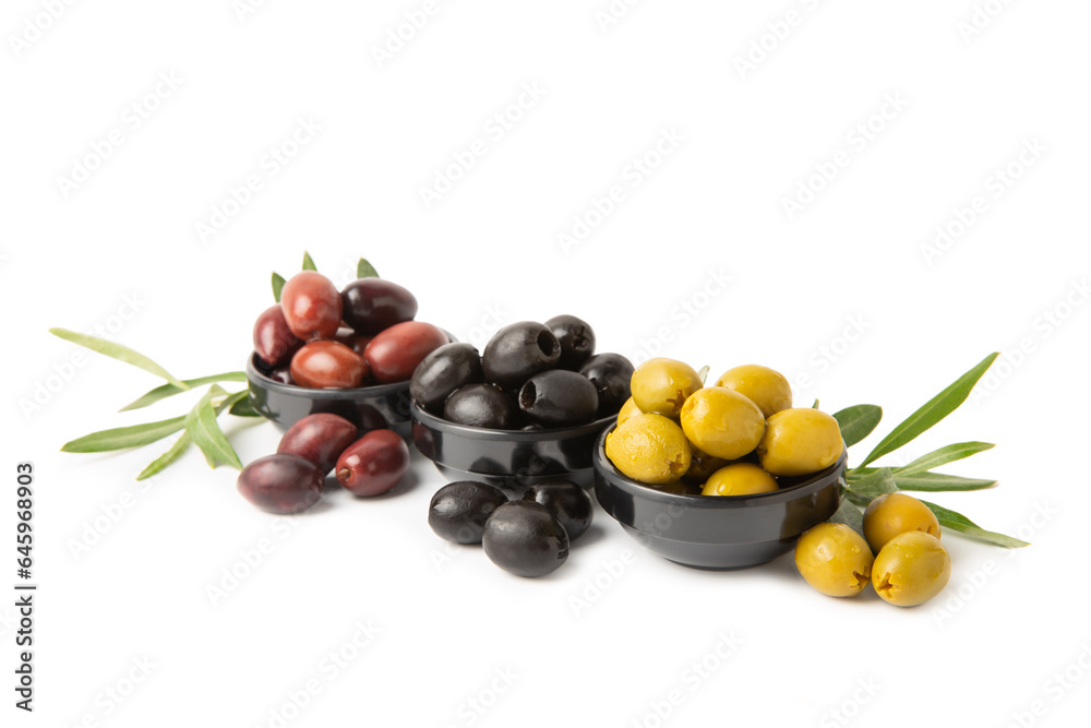 Green, black and red olives isolated on white background. Various types of olives and with fresh olive leaves. Mediterranean food. Vegan. Green, black and red olives isolated on white background. Various types of olives and with fresh olive leaves. Mediterranean food. Vegan.