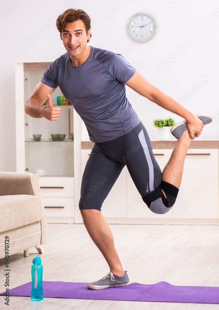 Man exercising for knee injury recovery Man exercising for knee injury recovery
