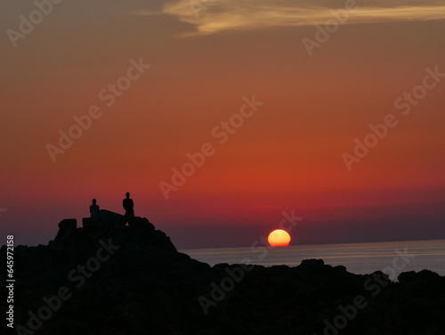 Puesta de sol desde Punta Nati cerca de Ciutadella de Menorca. photo