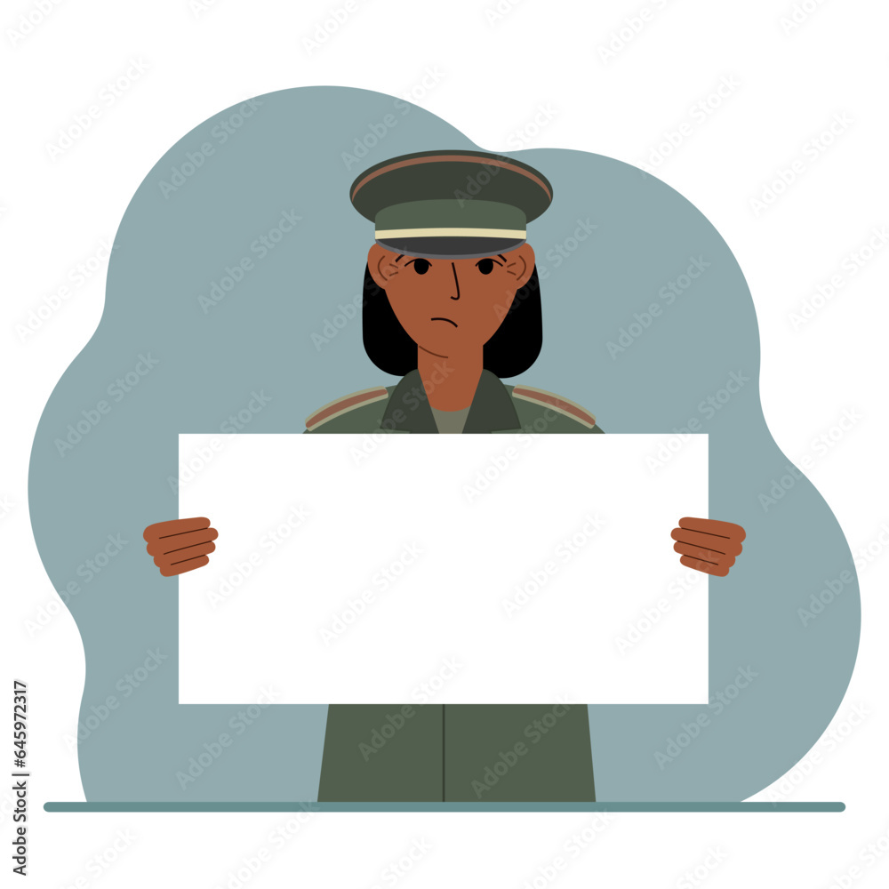 A military man in uniform holds a white sheet of paper in his hands. Concept for advertising, poster, banner. A military man in uniform holds a white sheet of paper in his hands. Concept for advertising, poster, banner.