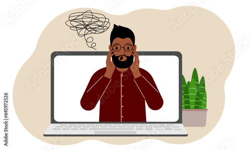 Online consultation with a psychologist. Laptop with a man with confused thoughts. Psychotherapeutic practice, psychiatric consultation.