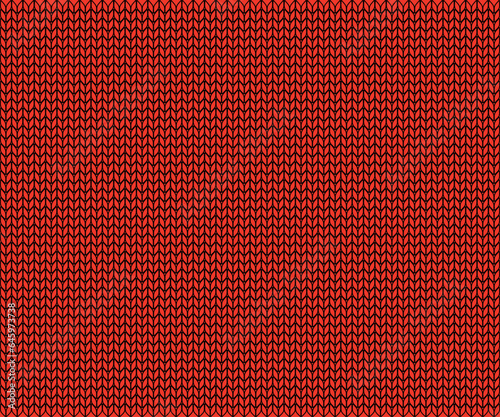 winter Christmas background in the texture of a warm red knitted sweater