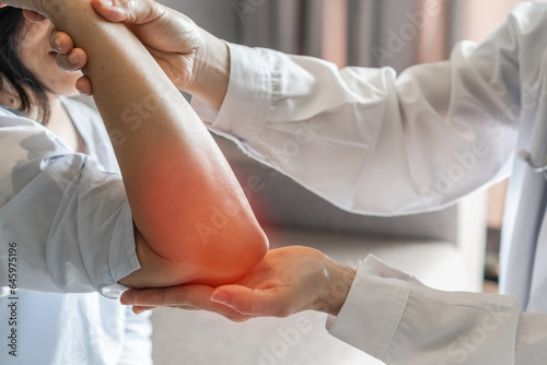 Rheumatism elbow pain, sore, cramp, numb, rheumatoid arthritis, osteoarthritis in woman patient having physical therapy consultation at orthopedic or physical therapist clinic