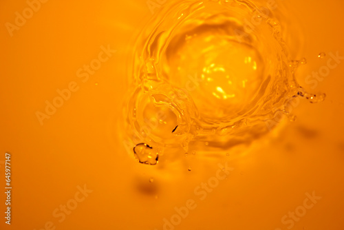 The surface of the water splashes orange.