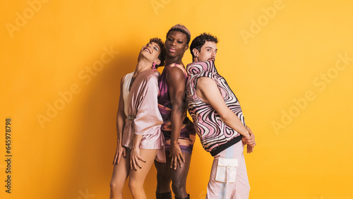Multiethnic trans men posing in a sensual way while looking at camera