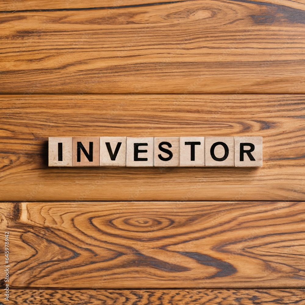 Word investor appearing to be man-made with wooden blocks