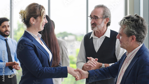 Принти на полотні Caucasian man leader introducing woman manager to new team partner at seminar of company