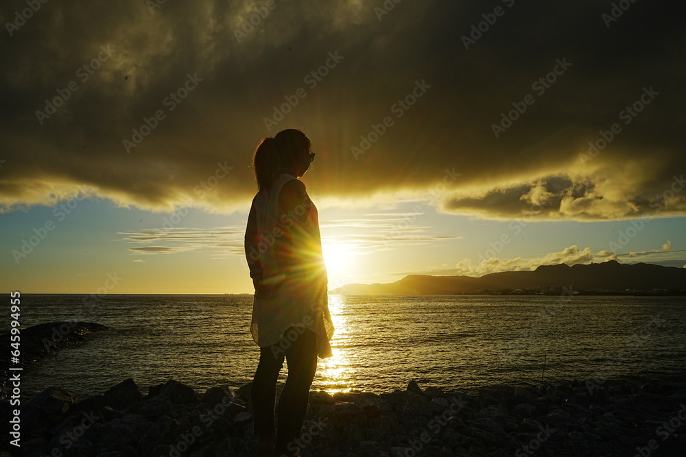 Woman standing on Sunset Beach in Nago, Okinawa, Japan - 日本 沖縄 名護 東江ビーチに立つ女性