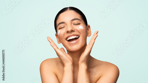 Glamorous natural beauty headshot portrait of a beautiful multiracial Turkish woman with perfect moisturized healthy skin and charming smile naked shoulders