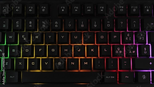 Modern backlit keyboard with pulsating rgb colour light. photo