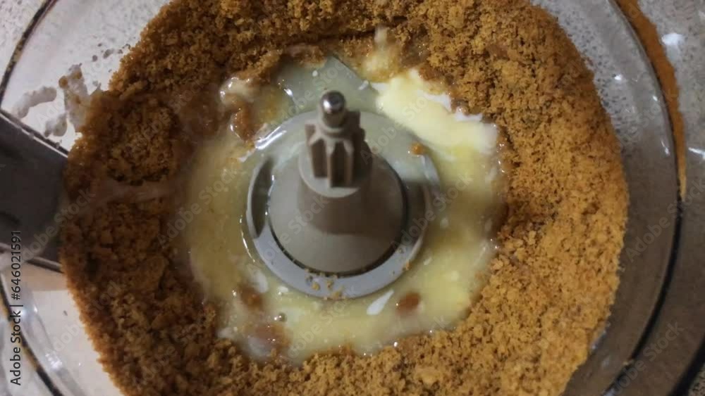pour butter on crushed biscuit mix in a blender