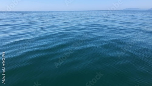 Blue sea water surface with  ripples texture background, sailing in calm water.	
