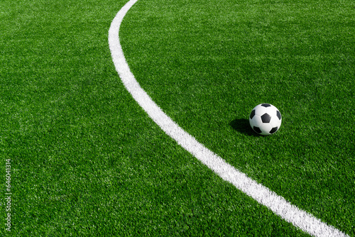 Black and white soccer and football ball in the field. Horizontal sport theme poster, greeting cards, headers, website and app © Augustas Cetkauskas