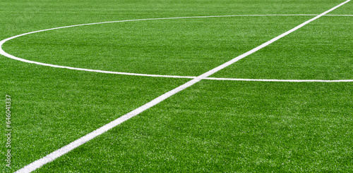 Green synthetic grass sports field with white line shot from above. Soccer  hurling  lacrosse  rugby  football  baseball sport concept