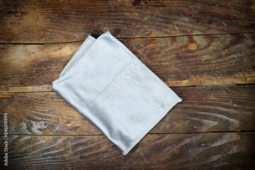 gray napkin on wooden table