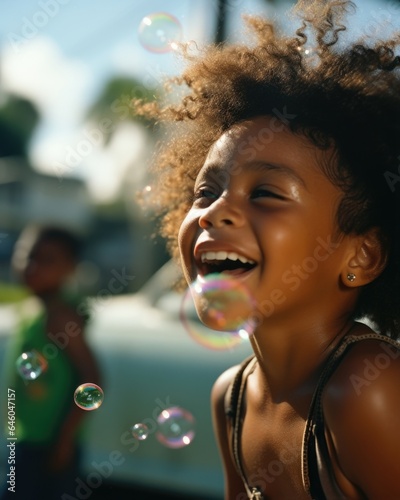 On sunny street African American woman, on verge of latter stage of life, delights herself by blowing soap bubbles incessantly. regression into this innocent activity underlines need