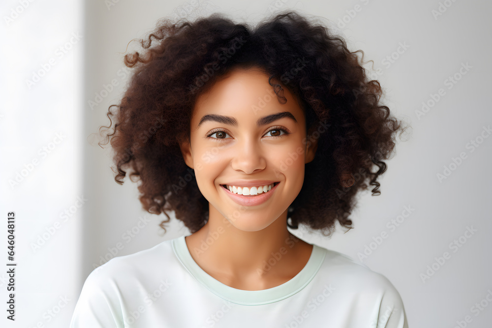 Beautiful young smiling afroamerican woman with curly hair portrait