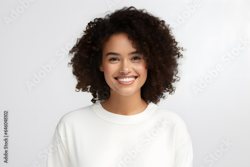 Beautiful young smiling afroamerican woman with curly hair portrait © Oksana