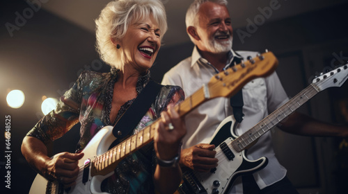 A senior couple strumming electric guitars, reliving their youthful musical passions