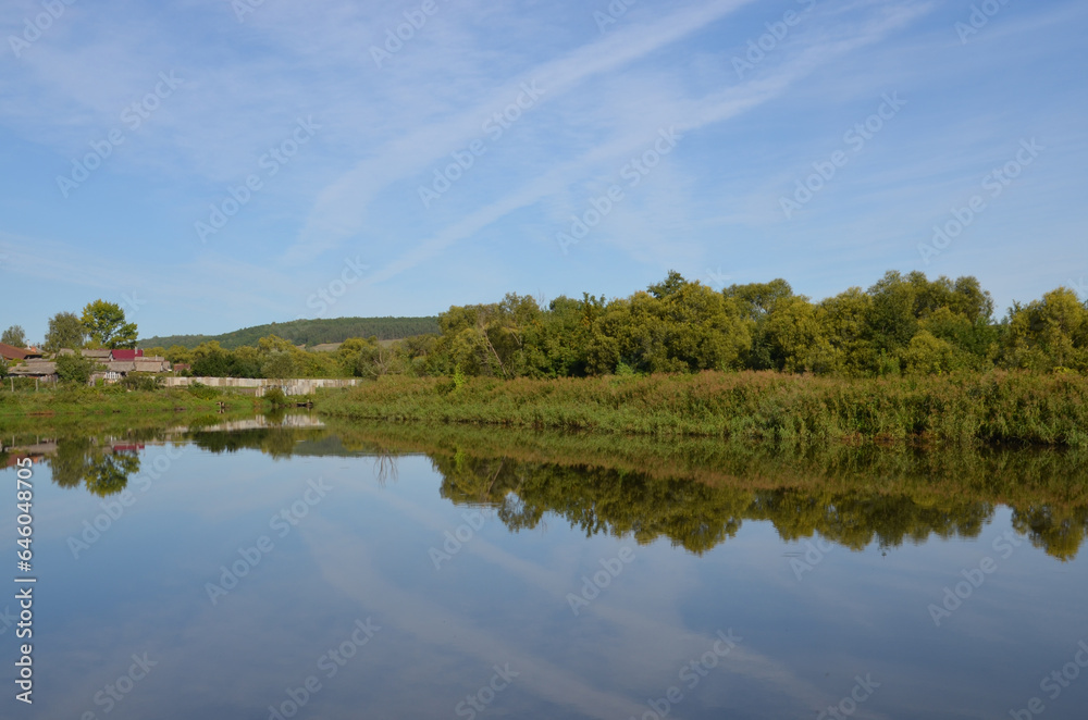 Summer landscapes. Reflection in the pond. Summer landscapes. Reflection in the pond.